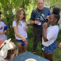Local students sample the SAP's honey